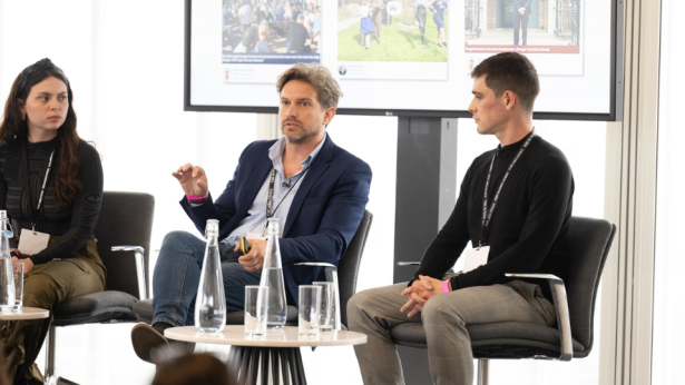 Three journalists at a Newsrewired talk.